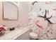 Charming powder room with floral wallpaper and a marble vanity at 2317 Houston Branch Rd, Charlotte, NC 28270