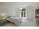 Bright bedroom with large window, stylish light fixture, and neutral decor at 2317 Houston Branch Rd, Charlotte, NC 28270