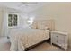 Inviting bedroom with plush bedding, a neutral color palette, and ample natural light at 2317 Houston Branch Rd, Charlotte, NC 28270