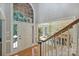 Elegant foyer with hardwood floors, staircase, and a view into the sunlit dining room at 2317 Houston Branch Rd, Charlotte, NC 28270