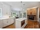 Beautiful kitchen featuring a center island, white countertops and cabinets, and stainless steel appliances at 2317 Houston Branch Rd, Charlotte, NC 28270