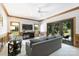 Cozy living room featuring wood trim, a ceiling fan, and sliding doors to the outdoor area at 2317 Houston Branch Rd, Charlotte, NC 28270