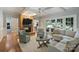 Cozy living room with a brick fireplace, French doors, and comfortable seating arrangement at 2317 Houston Branch Rd, Charlotte, NC 28270