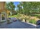 Inviting patio space with lounge seating overlooking a beautifully landscaped backyard at 2317 Houston Branch Rd, Charlotte, NC 28270