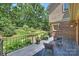 Relaxing patio featuring outdoor seating, brick accents, and scenic backyard views at 2317 Houston Branch Rd, Charlotte, NC 28270