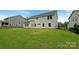 Spacious backyard featuring a well-maintained lawn and privacy fencing at 2382 Drake Mill Sw Ln, Concord, NC 28025