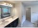 A modern bathroom includes double sinks, a large mirror, and a separate tub and shower at 2382 Drake Mill Sw Ln, Concord, NC 28025