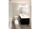 Bathroom featuring a dark wood vanity, a large white countertop, and a toilet at 2382 Drake Mill Sw Ln, Concord, NC 28025