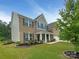 Two-story home with brick and vinyl siding, attached garage, and a well-manicured lawn at 2382 Drake Mill Sw Ln, Concord, NC 28025