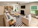 Bright living room with fireplace, built-in shelving, and stylish decor, virtually staged for design inspiration at 2382 Drake Mill Sw Ln, Concord, NC 28025