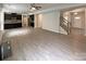 Open-concept home showcasing kitchen, dining, and living spaces, with hardwood floors and staircase access at 2382 Drake Mill Sw Ln, Concord, NC 28025