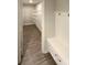 Mud room with bench, storage, and walk-in closet, offering convenient organization as you enter from garage at 2382 Drake Mill Sw Ln, Concord, NC 28025