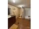 This bathroom features a dark vanity and a shower/tub combination with a yellow floral shower curtain at 2418 6Th Sw Ave, Hickory, NC 28602
