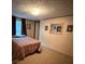 This bedroom has neutral carpet and a twin bed with a window, allowing natural light at 2418 6Th Sw Ave, Hickory, NC 28602