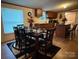 Bright dining area featuring a large dining table set for a meal with dark wood cabinets in the background at 2418 6Th Sw Ave, Hickory, NC 28602