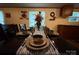 Close-up of a dining table set with decorative dinnerware and a floral centerpiece at 2418 6Th Sw Ave, Hickory, NC 28602