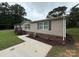 Single-story home featuring a paved walkway and well-maintained lawn at 2418 6Th Sw Ave, Hickory, NC 28602