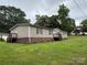 A single-story home featuring a well-manicured lawn and a quaint front porch at 2418 6Th Sw Ave, Hickory, NC 28602