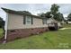 View of single-story house with brick foundation and vinyl siding at 2418 6Th Sw Ave, Hickory, NC 28602