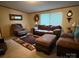 Comfortable living room features plush seating, a neutral color palette, and bright, natural light from the windows at 2418 6Th Sw Ave, Hickory, NC 28602