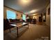 Spacious living room that shows view into the kitchen and dining area with a large sofa at 2418 6Th Sw Ave, Hickory, NC 28602