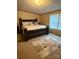 Comfortable main bedroom with a bed, a patterned rug and a bright window at 2418 6Th Sw Ave, Hickory, NC 28602