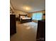 Cozy main bedroom with a large bed, plush pillows, and natural light streaming through the windows at 2418 6Th Sw Ave, Hickory, NC 28602