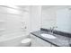 Bright bathroom with a shower-tub combination, toilet, and granite vanity at 259 Miramar Dr, York, SC 29745