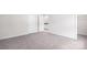 A bedroom with neutral walls and carpet leading to a bathroom and closet at 259 Miramar Dr, York, SC 29745