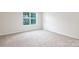 Bright bedroom with neutral carpet and large window for lots of natural light at 259 Miramar Dr, York, SC 29745
