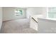 Bright bonus room with neutral carpet and large window for lots of natural light at 259 Miramar Dr, York, SC 29745