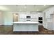 Bright kitchen showcasing a large center island, white cabinets, and modern stainless steel appliances at 259 Miramar Dr, York, SC 29745