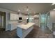 Open kitchen with large island, stainless appliances and white cabinets at 259 Miramar Dr, York, SC 29745