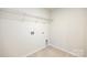 Clean and functional laundry room with tile floors, washer and dryer hookups, and wire shelving at 259 Miramar Dr, York, SC 29745