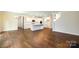 Living room and kitchen area feature hardwood floors and neutral paint tones with an open concept layout at 259 Miramar Dr, York, SC 29745