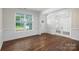 A bright living room with hardwood floors, molding, and a large window at 259 Miramar Dr, York, SC 29745