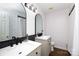 Contemporary bathroom with black framed vanity mirrors, dual sinks, and modern fixtures at 2765 Dogwood Cir, Rock Hill, SC 29732