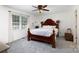 Spacious bedroom features a large window for natural light, ceiling fan, and a decorative headboard at 2765 Dogwood Cir, Rock Hill, SC 29732