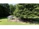 An aerial view highlights a chicken coop and poultry run, providing a sustainable lifestyle feature on the property at 2765 Dogwood Cir, Rock Hill, SC 29732