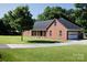 Beautiful brick home featuring a side-entry garage and a circular driveway at 2765 Dogwood Cir, Rock Hill, SC 29732
