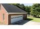 Spacious garage with a modern door, integrated into the home's brick design at 2765 Dogwood Cir, Rock Hill, SC 29732