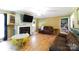Cozy living room with a fireplace, warm colors and hardwood floors at 2765 Dogwood Cir, Rock Hill, SC 29732