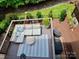 Outdoor deck featuring a lounge area and a grill, surrounded by lush landscaping at 3036 Luke Crossing Dr, Charlotte, NC 28226