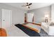 Bedroom with hardwood floors, area rug, and view into adjoining room at 3036 Luke Crossing Dr, Charlotte, NC 28226