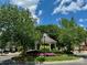 Charming community gazebo surrounded by manicured landscaping, green lawns, and mature trees at 3036 Luke Crossing Dr, Charlotte, NC 28226