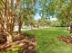 Scenic view of a community greenspace featuring mature trees, lush lawns, and well-maintained landscaping at 3036 Luke Crossing Dr, Charlotte, NC 28226