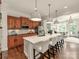 Spacious kitchen features a large center island with marble countertop and pendant lighting at 3036 Luke Crossing Dr, Charlotte, NC 28226