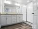 Bathroom with double vanity, granite countertop, subway tile shower, and modern fixtures at 334 Ladybird Ln, Pineville, NC 28134