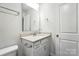 Bathroom features a vanity with granite countertop and modern fixtures at 334 Ladybird Ln, Pineville, NC 28134