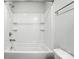Bright bathroom featuring a shower and tub combo with tiled surround at 334 Ladybird Ln, Pineville, NC 28134